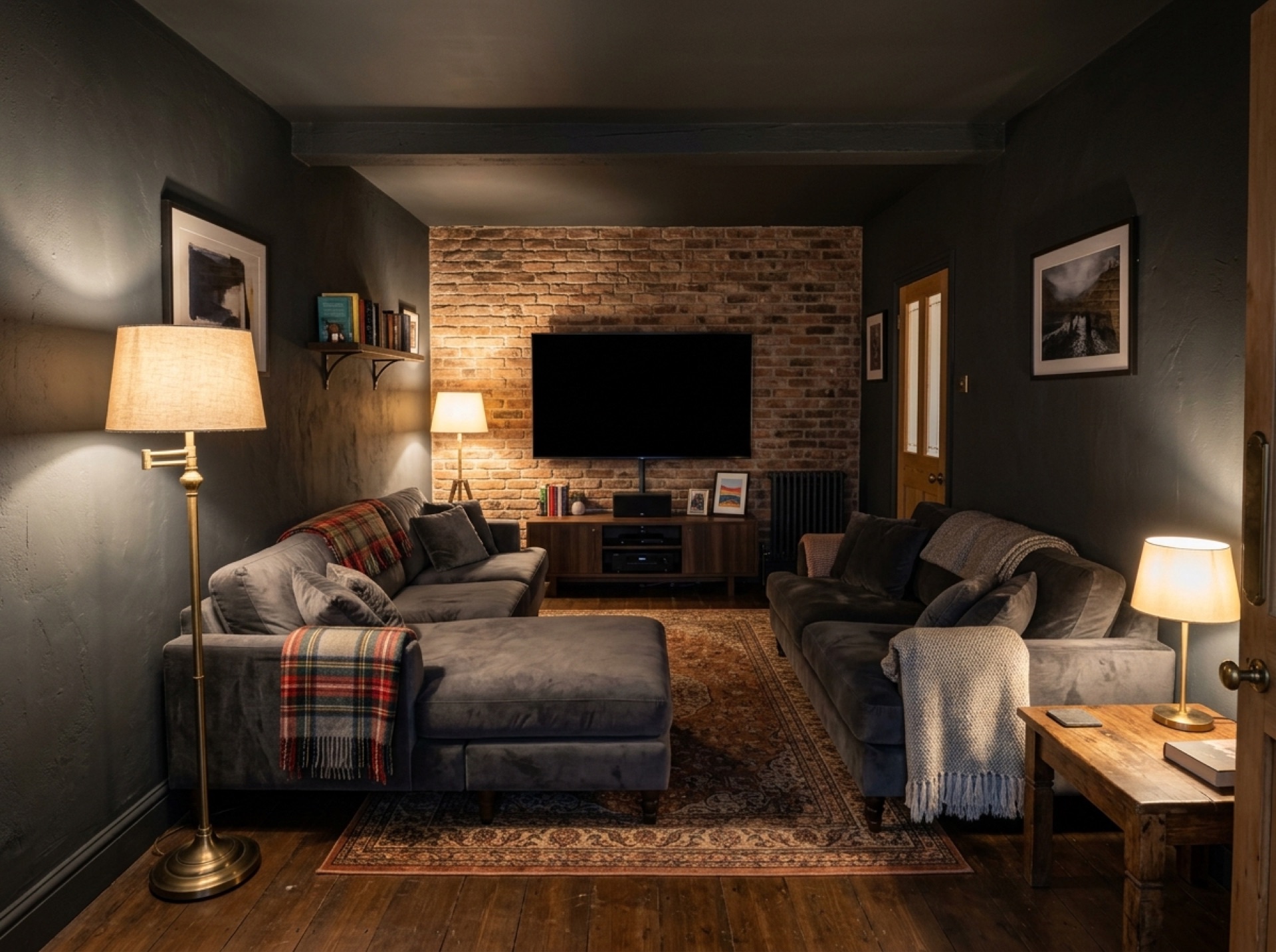 Converted garage used as a home cinema snug with a sofa and soft lamps